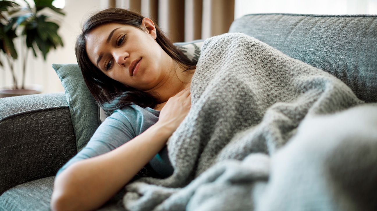 Woman feeling fatigued because of GERD symptoms