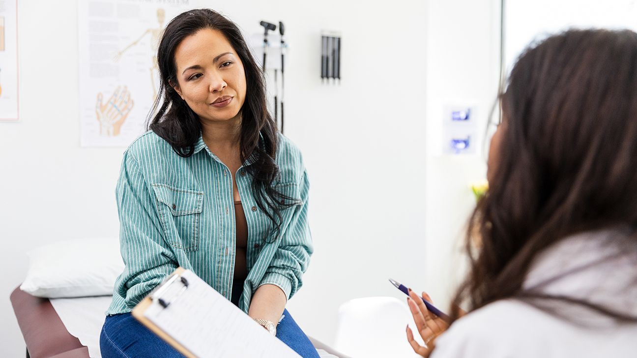 woman discussing squamous cell vulvar cancer with her doctor-1