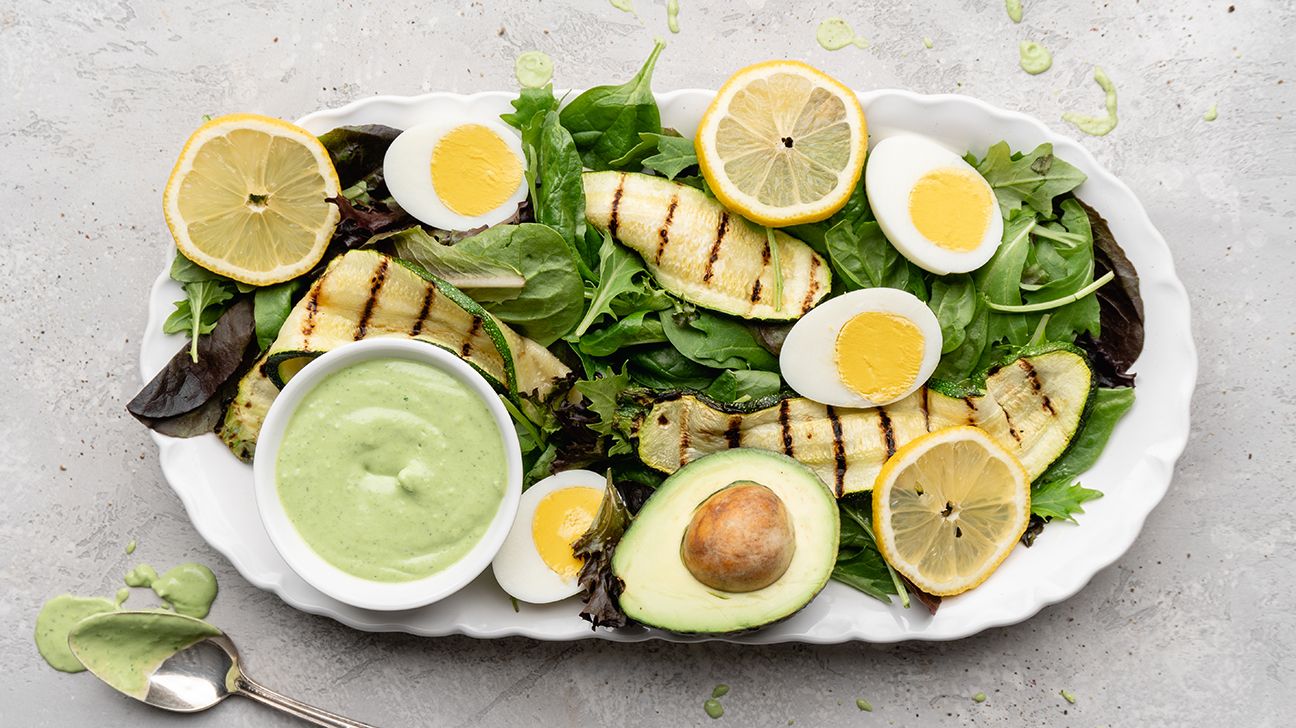 Grilled zucchini salad with egg and avocado
