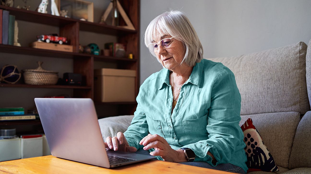 senior looking at computer