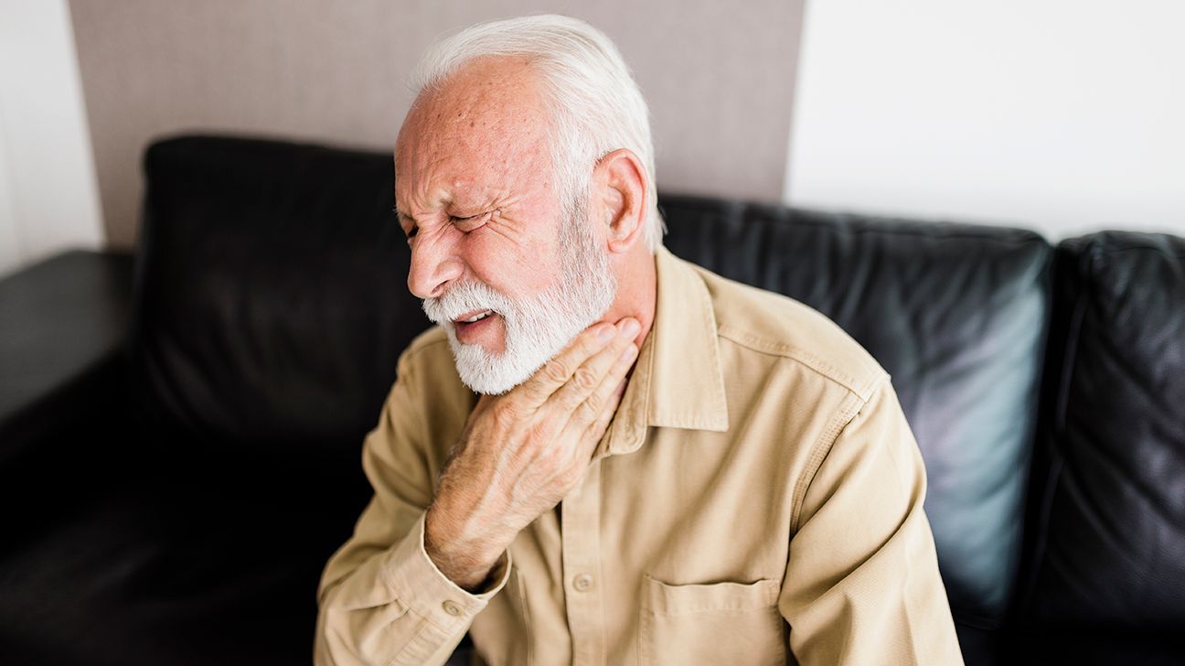 Older man with symptoms of an acid reflux attack