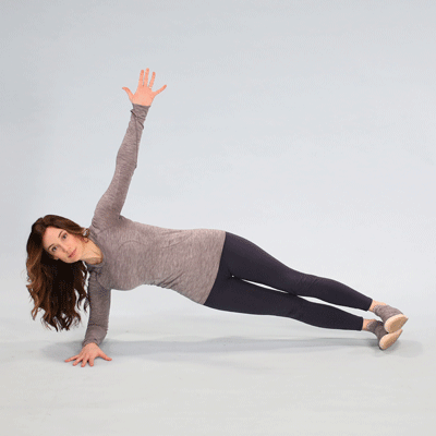 female performing side plank with leg lift