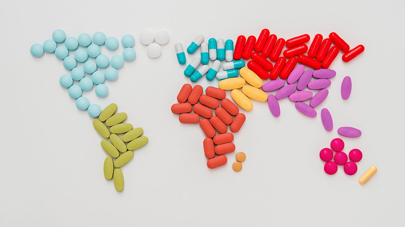 colorful pills arranged in shape of world map