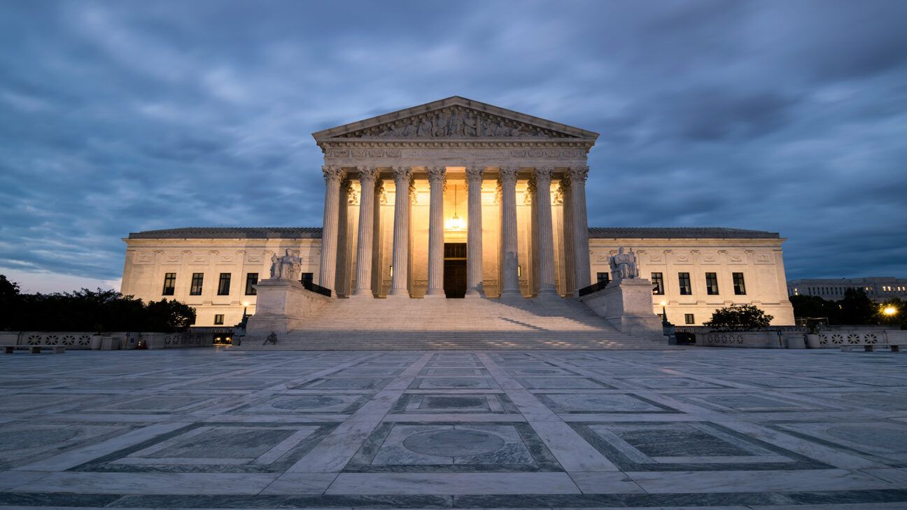 Image of the U.S. Supreme Court seen with cloudy skies.