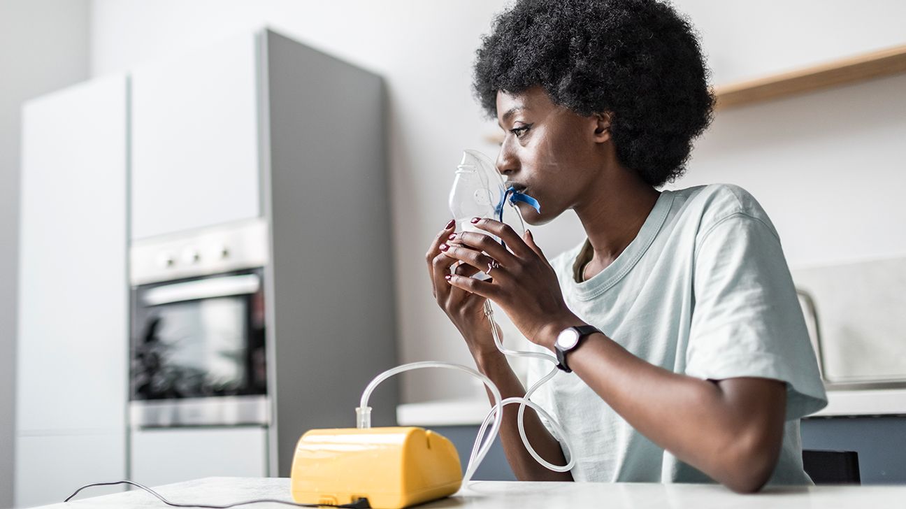 person with atypical cystic fibrosis doing a breathing treatment-1