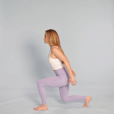 female performing jumping lunge