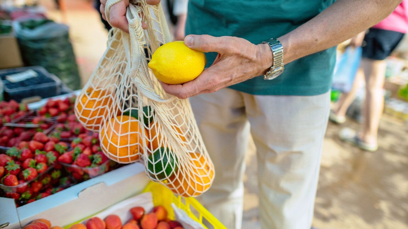 A person buying fruit.