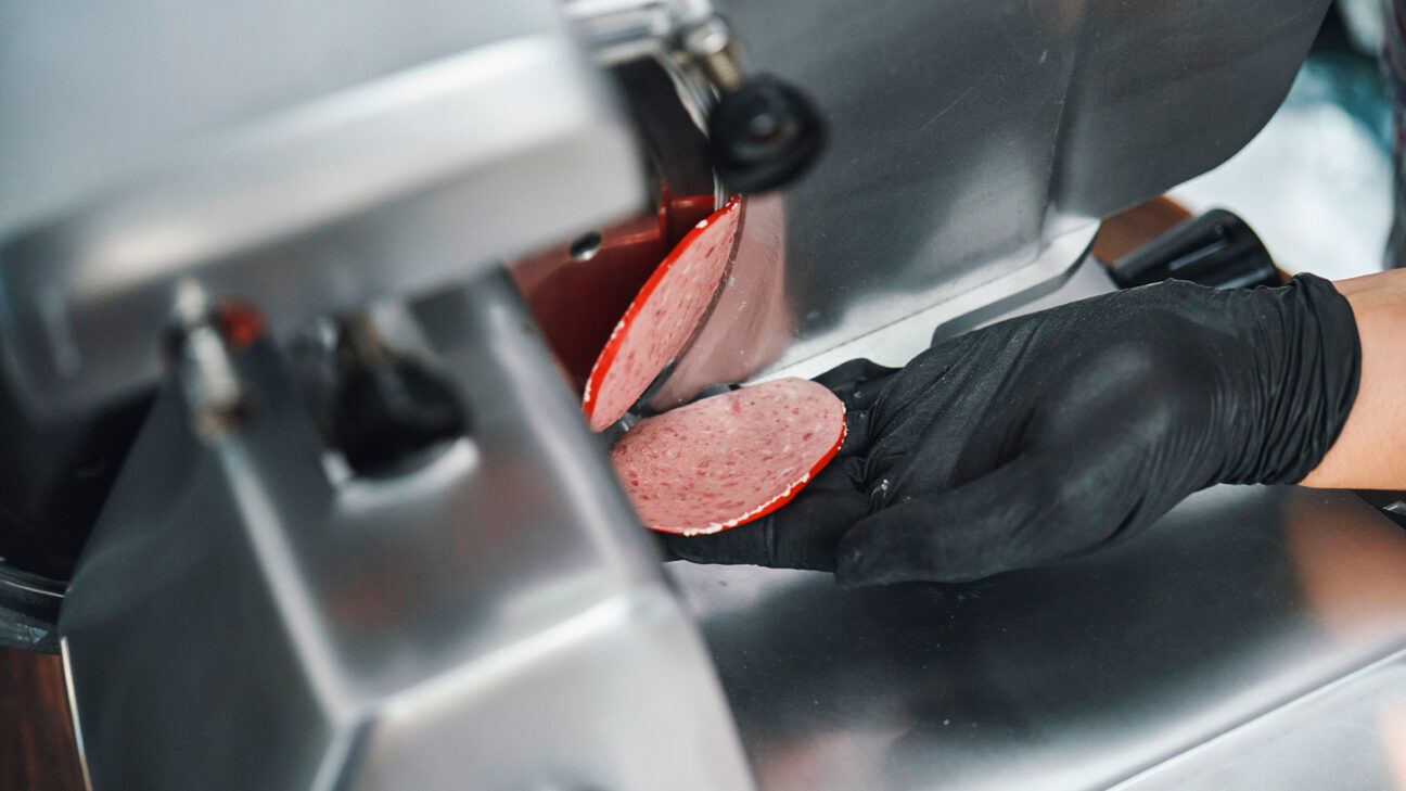 Deli meat being sliced