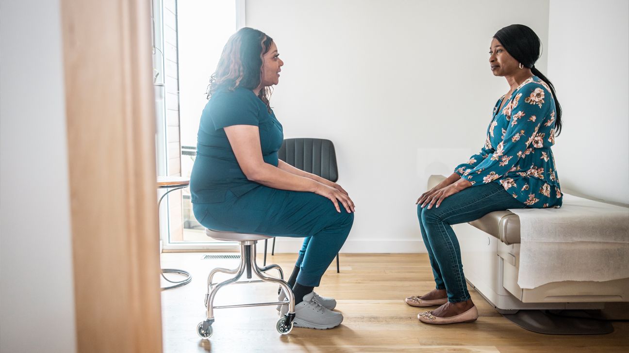 A doctor and patient talking.