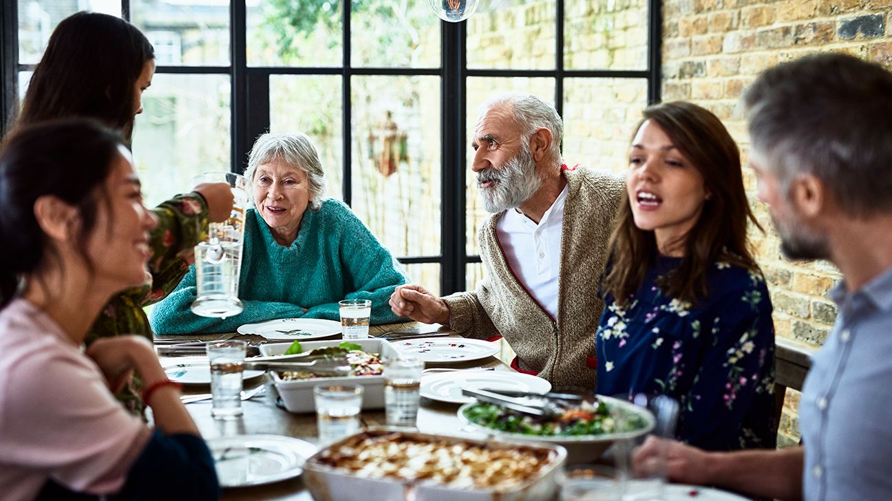 A family around a table, having a meal together