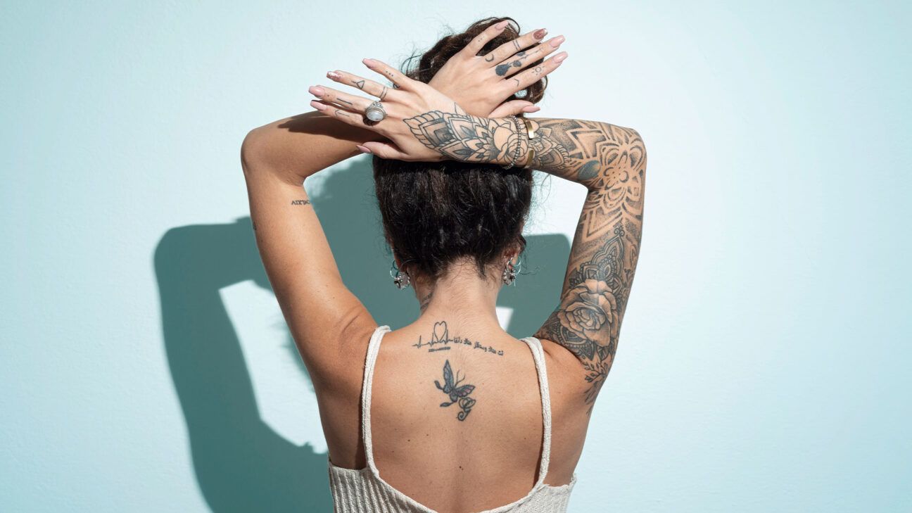 Female with tattoos rearview