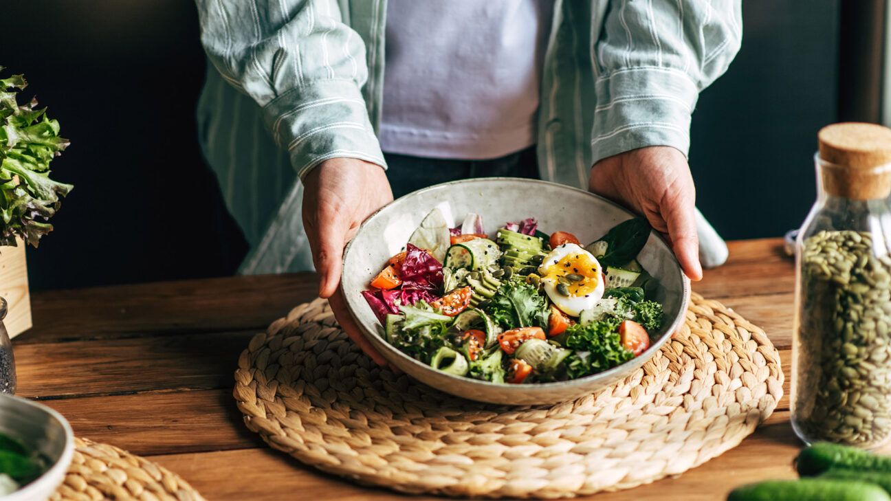 Salad in a bowl on a wooden table