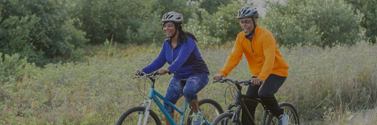 Two adults riding bicycles