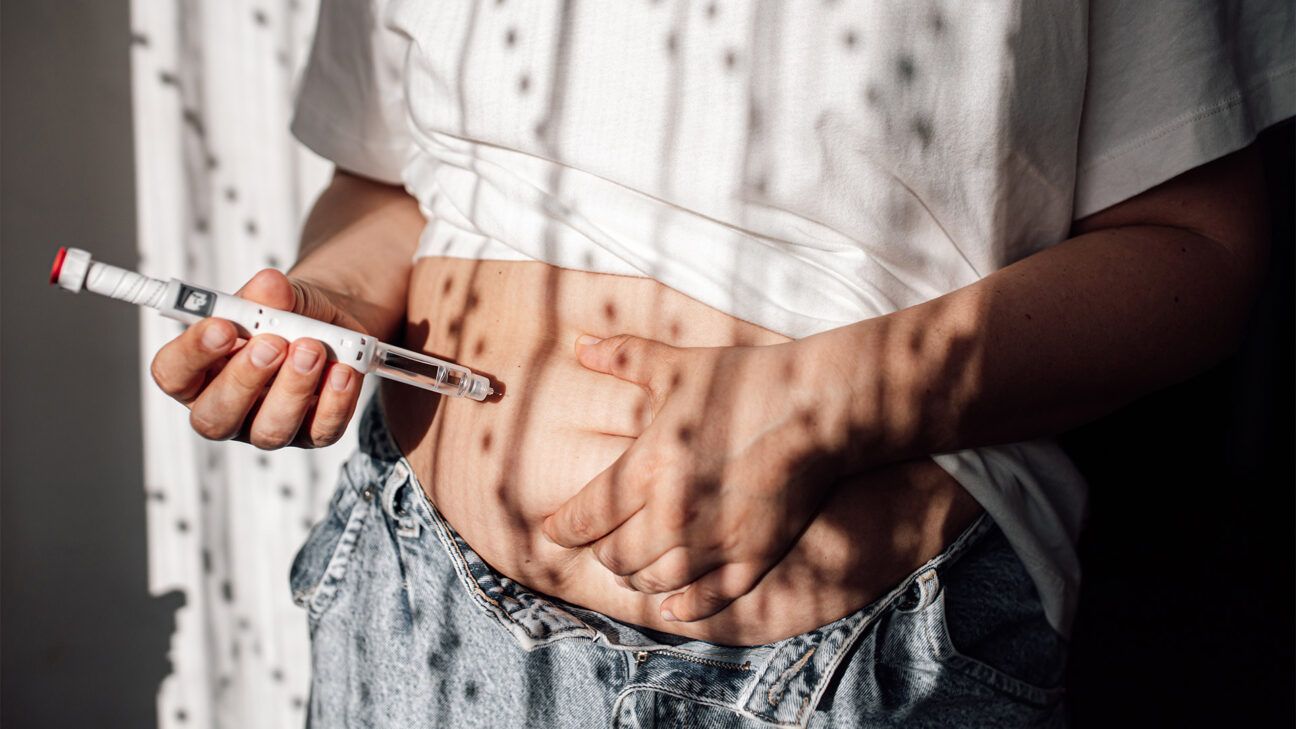 A person using an Ozempic injection pen.