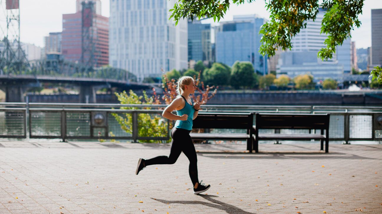 Female jogging outdoors in the city