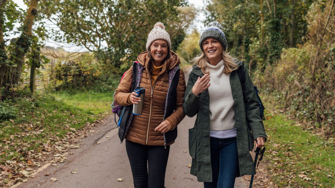 Two female friends walking outdoors