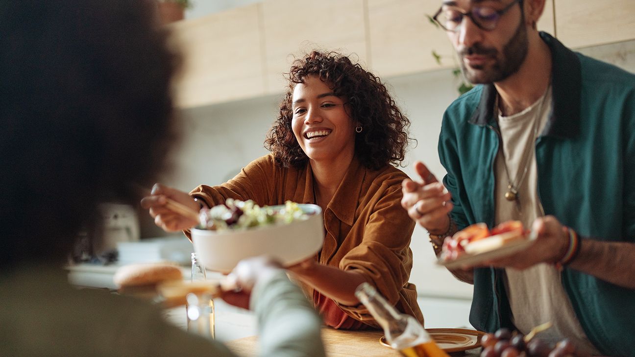 Female in kitchen with friends