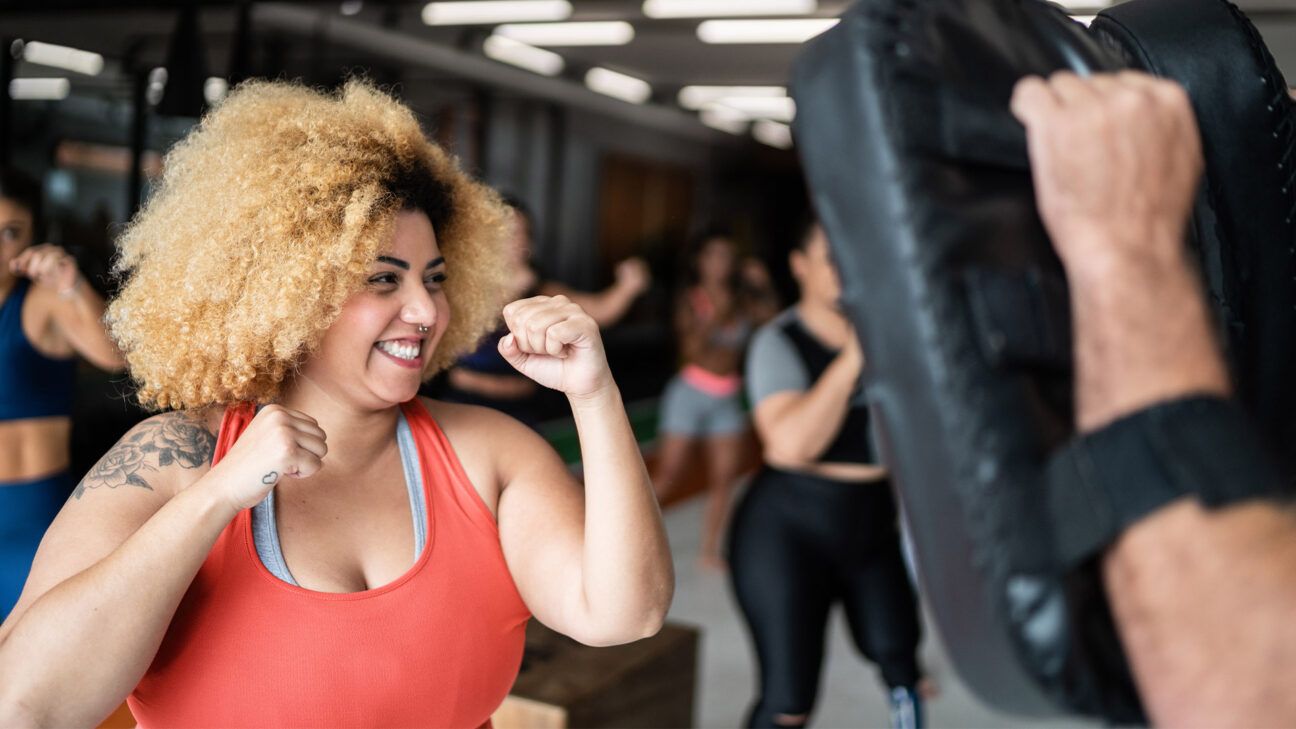 Female in a group boxing class