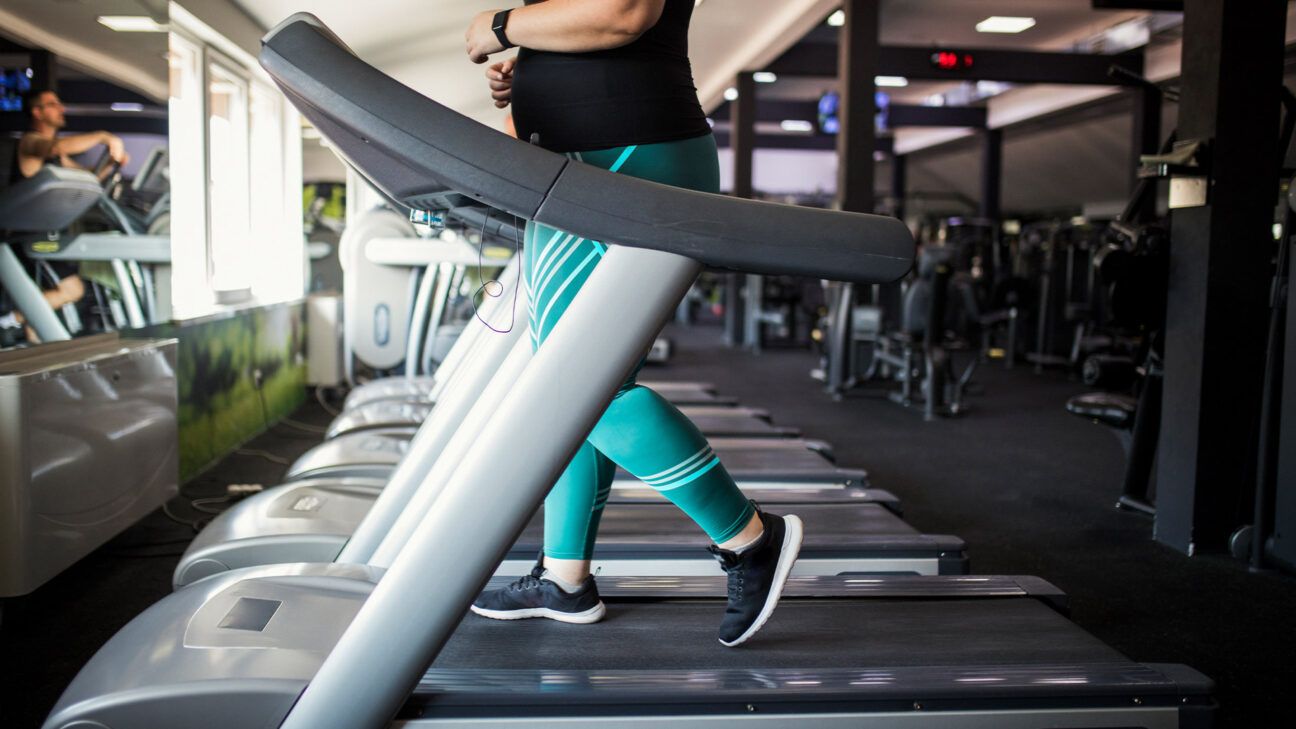 A female running on a treadmill.