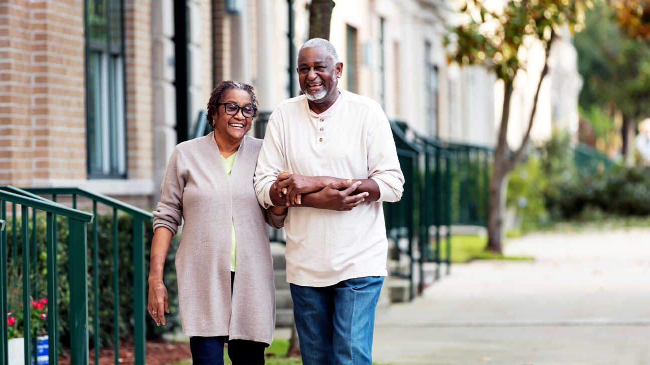 Older couple walking outside