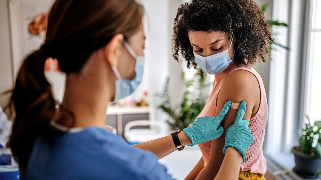 Female getting a measles shot