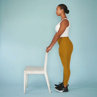 Woman doing heel-toe raises with a chair