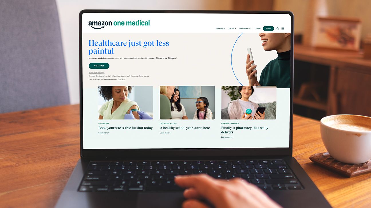 a person is looking right at a laptop screen. The screen has the home page of Amazon One Medical open.