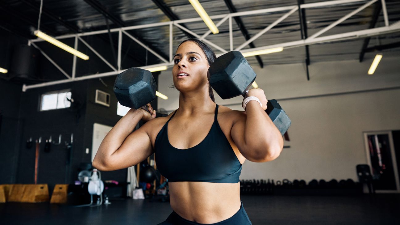 Female athlete lifting weights