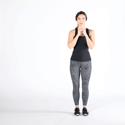 female performing side squat