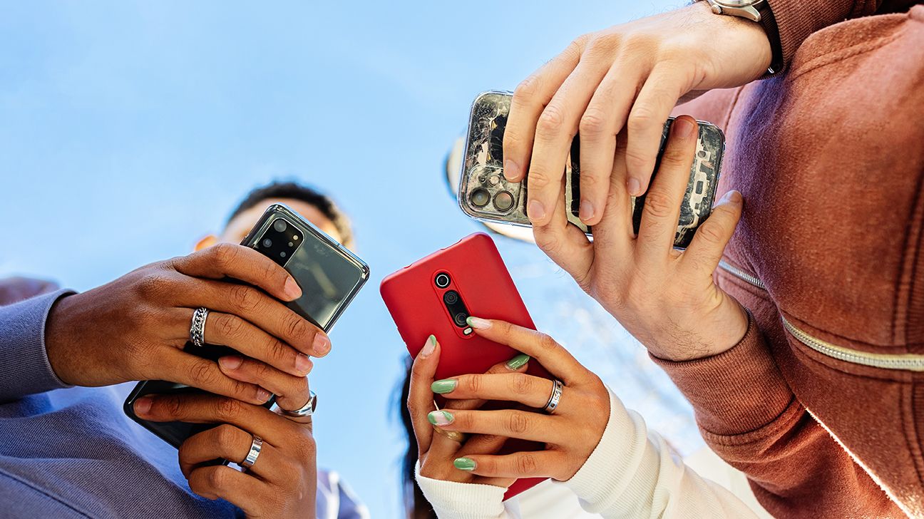 three people using their phone