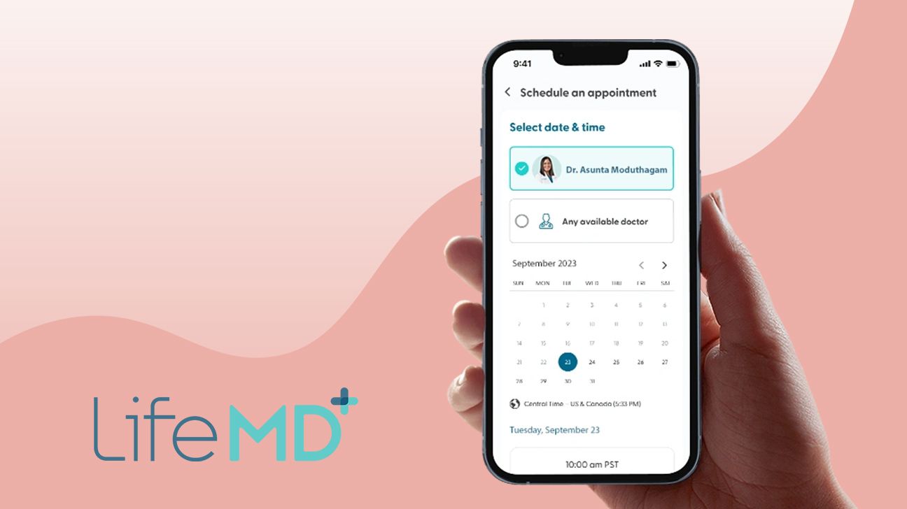 LifeMD screenshot on phone held up by and alongside isolated logo, over pink wavy gradient background.