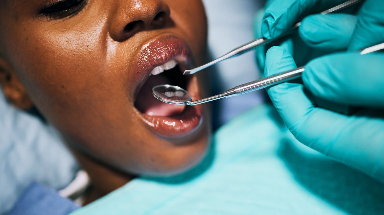 Female receiving dental cleaning