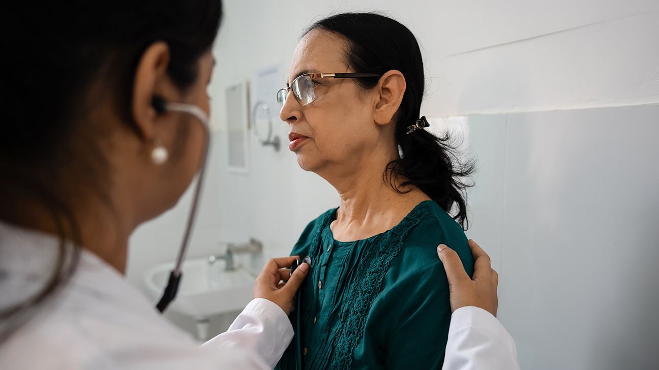 Doctor examining female patient