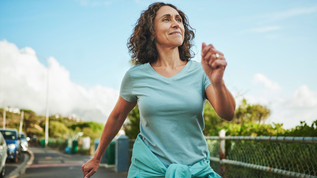 Female brisk walking outside