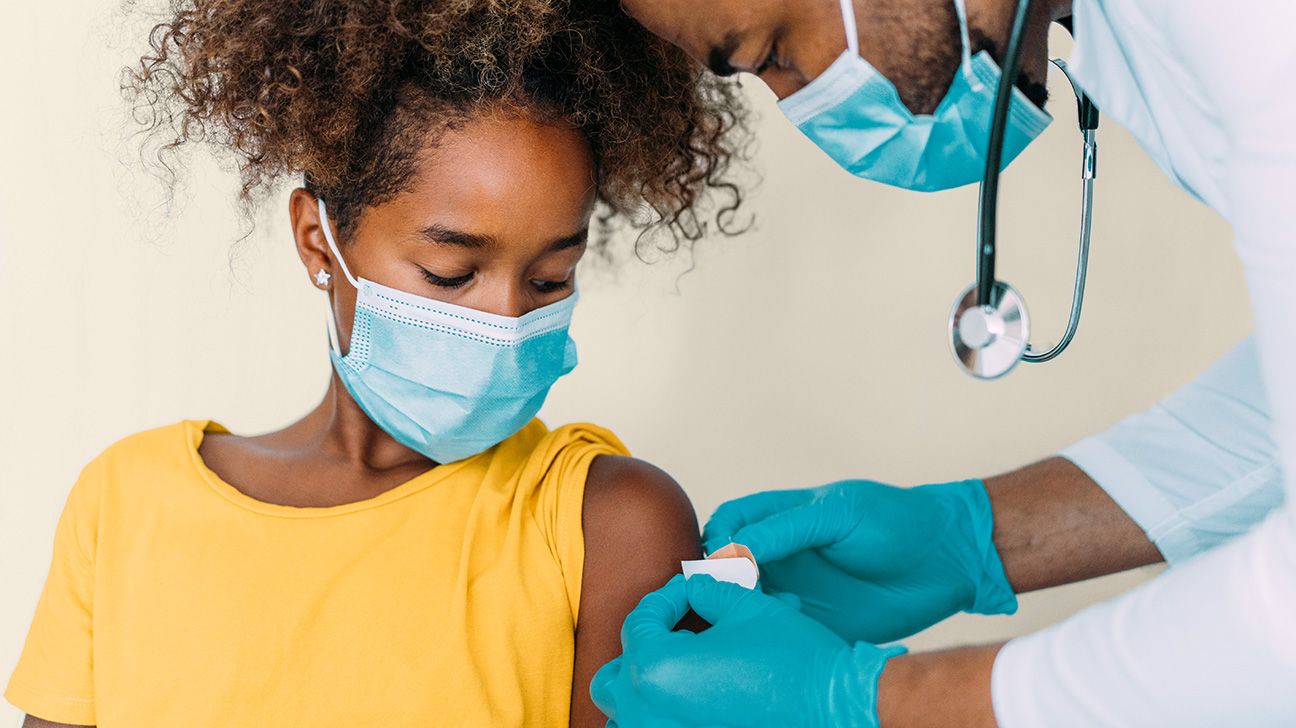 Young female receives flu vaccine