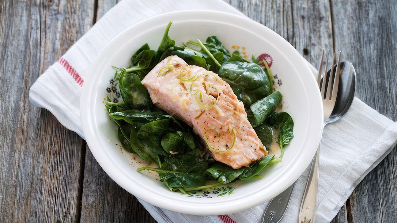 Coconut-poached salmon with spinach and rice noodles