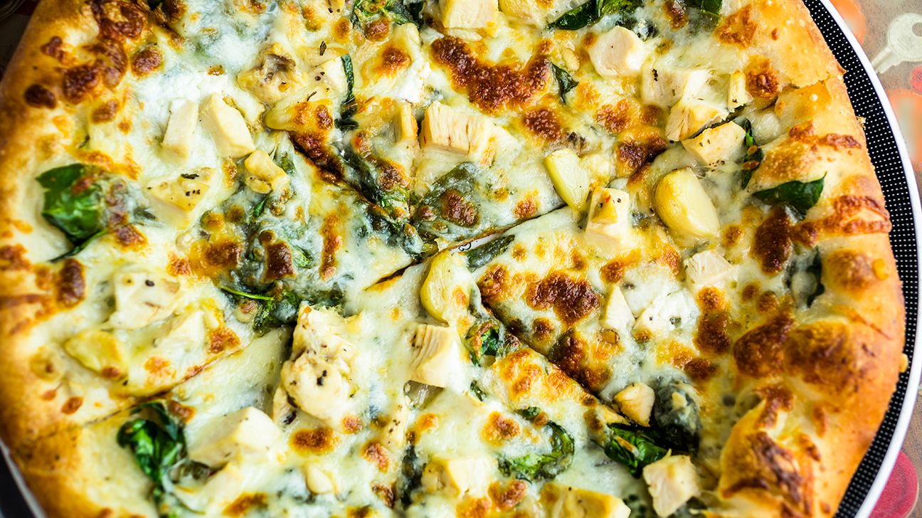 Chicken pesto pizza with spinach salad