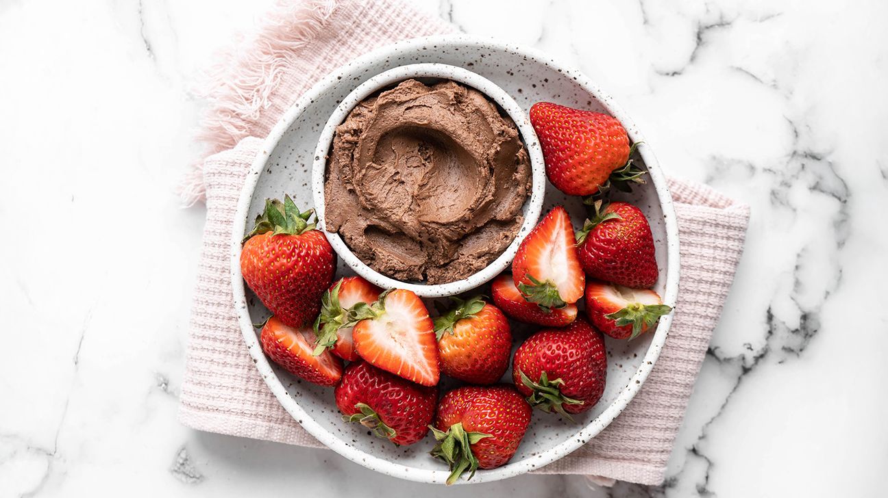 Healthy chocolate peanut butter dip with strawberries