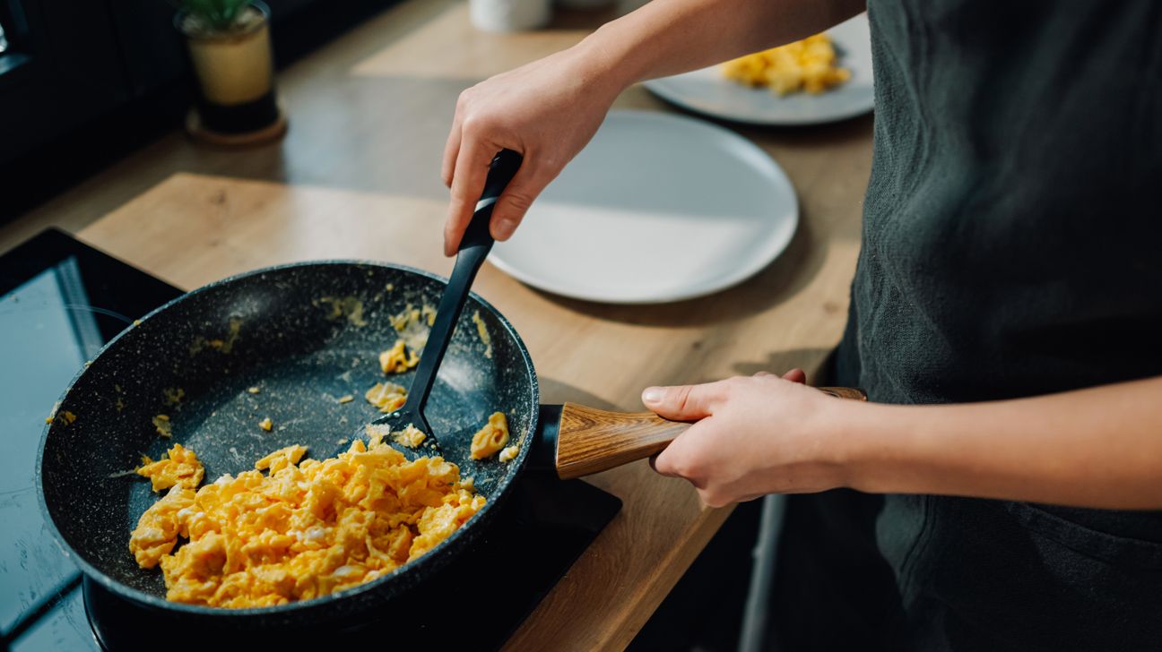 preparing scrambled eggs