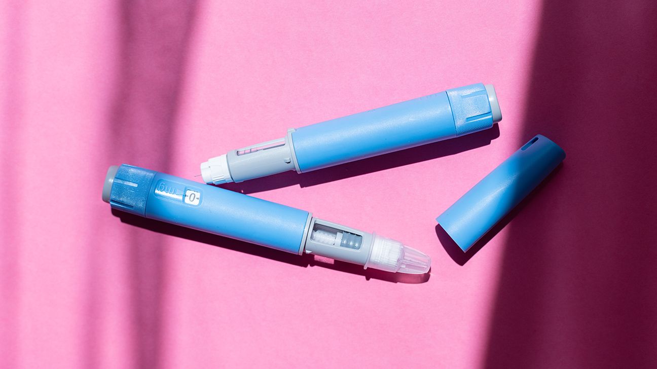 two Ozempic pens on pink background