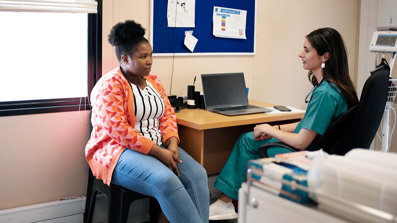 Female patient talking with doctor