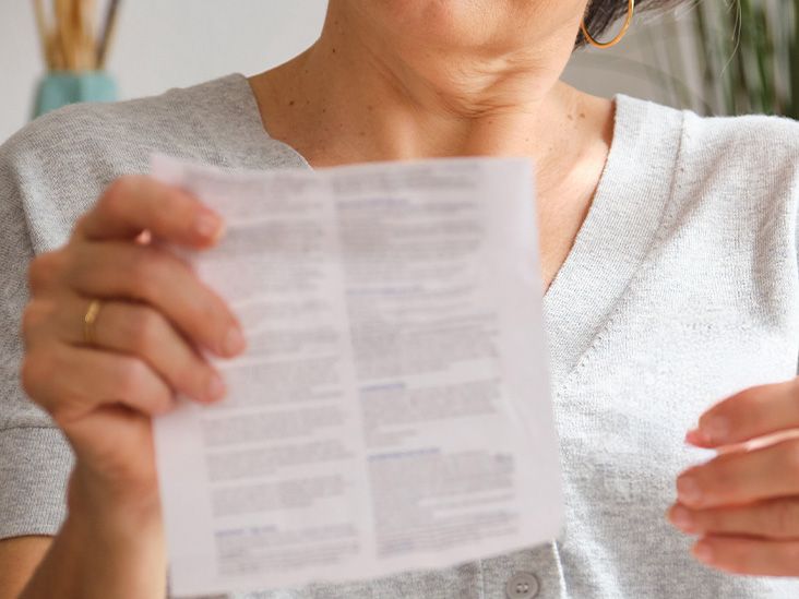A person is reading medical instrutions.