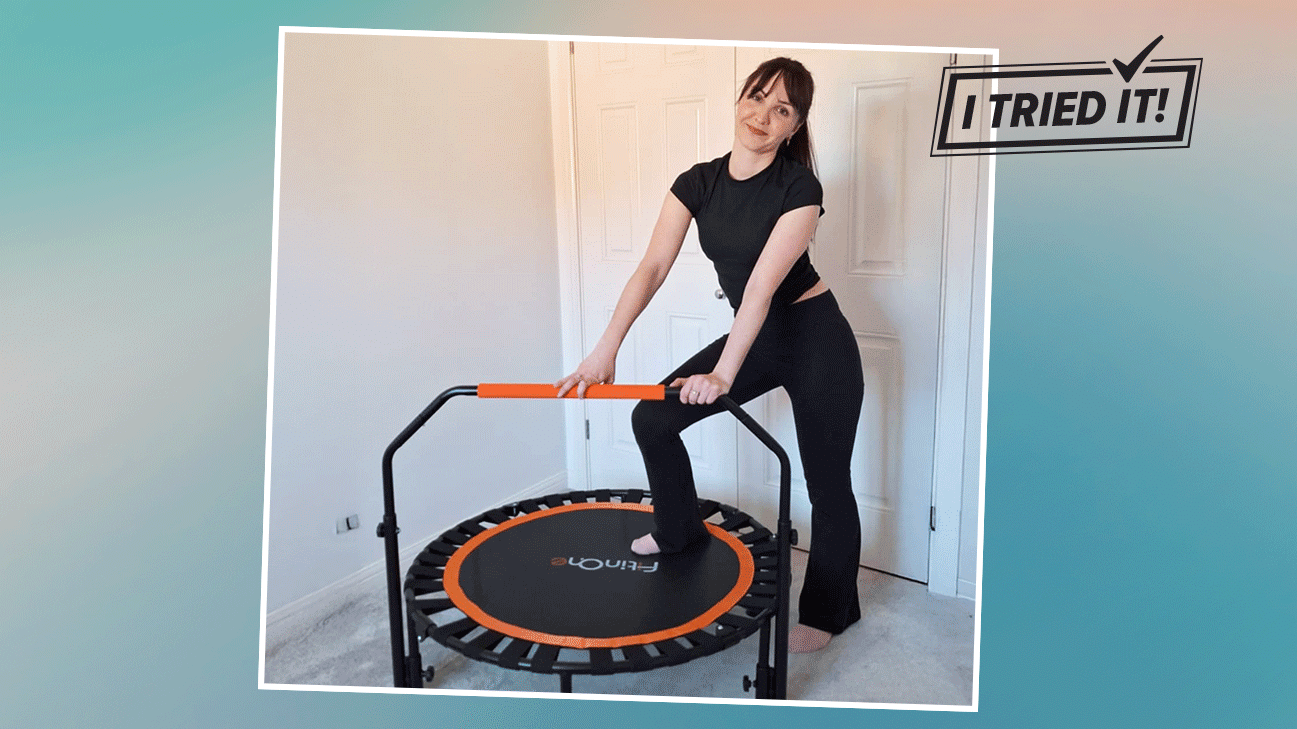 Healthline Editor posing with her rebounder trampoline. 