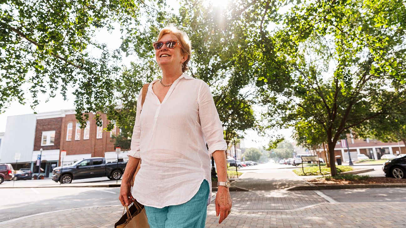Female walking outside in the sun