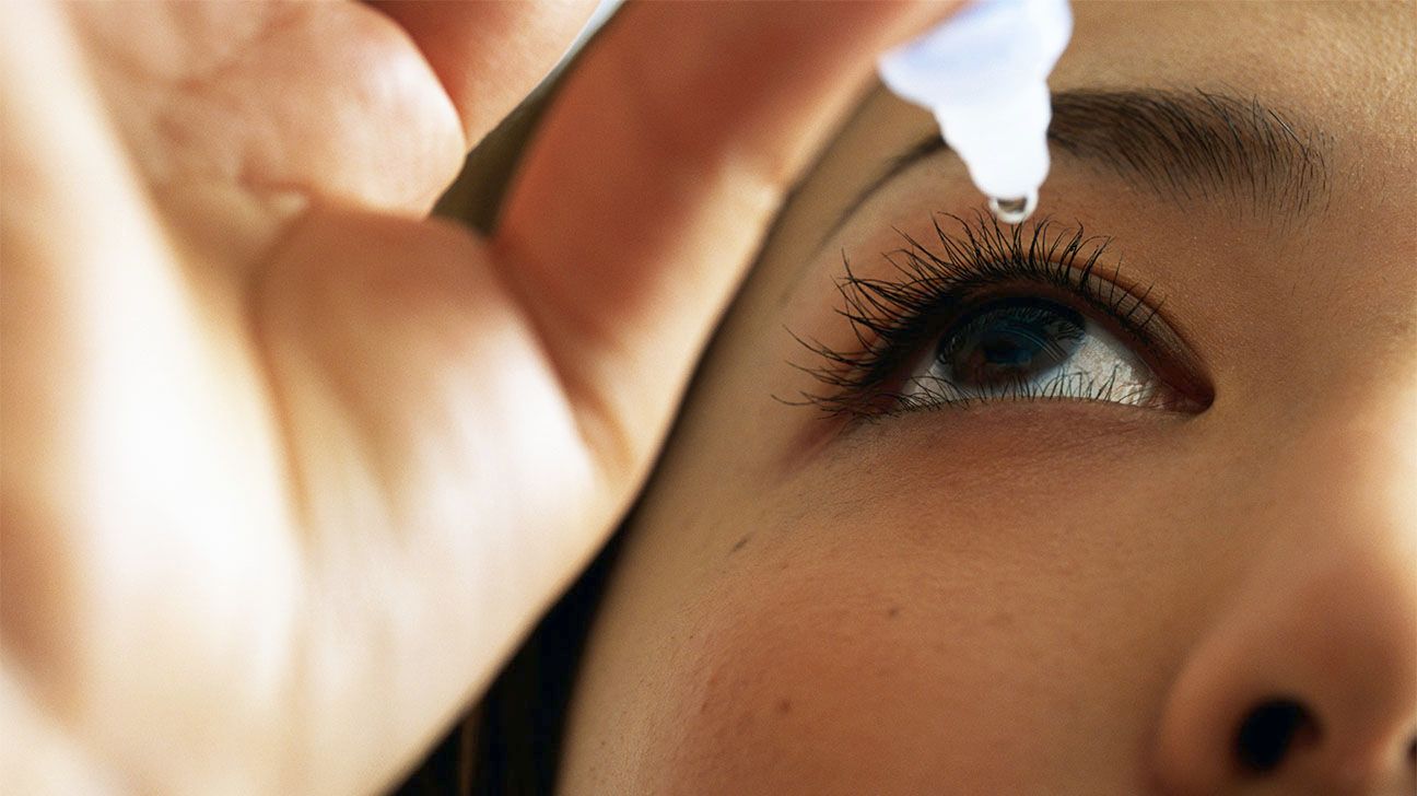 Female administers eye drops