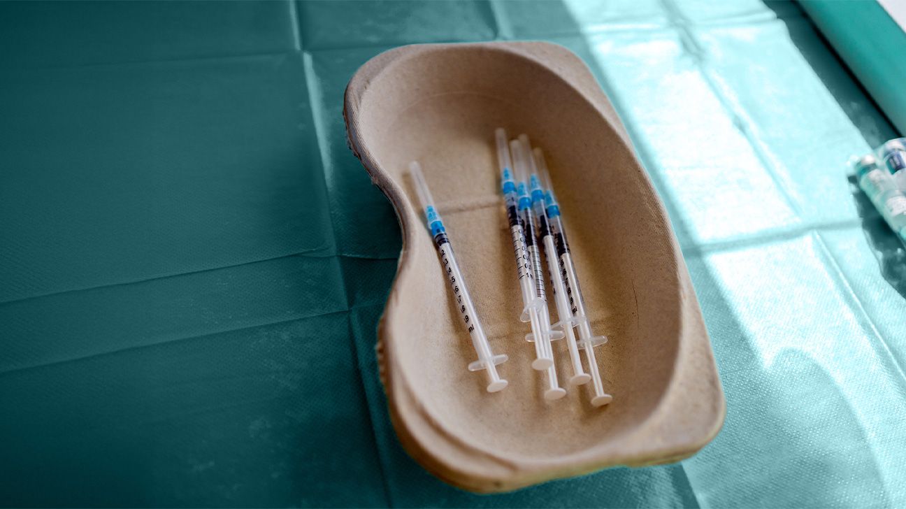 Medical syringes in a plastic tub