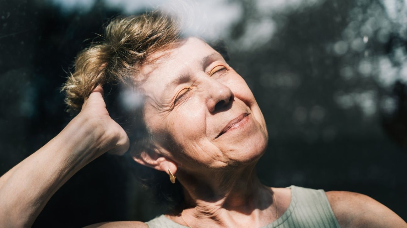 Older female with sunlight on face