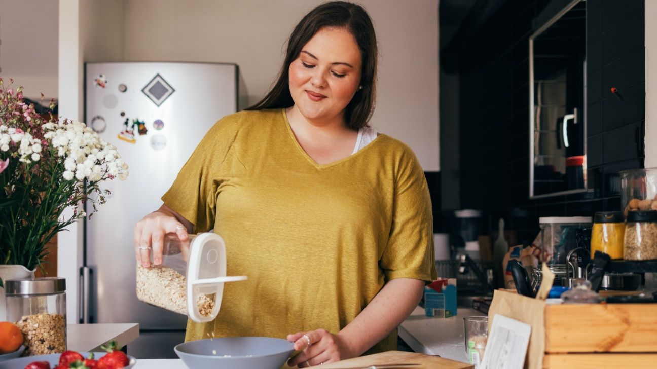 Woman preparing oats in a bowl