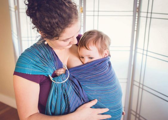 The author, Galen, wearing her baby in a blue wrap