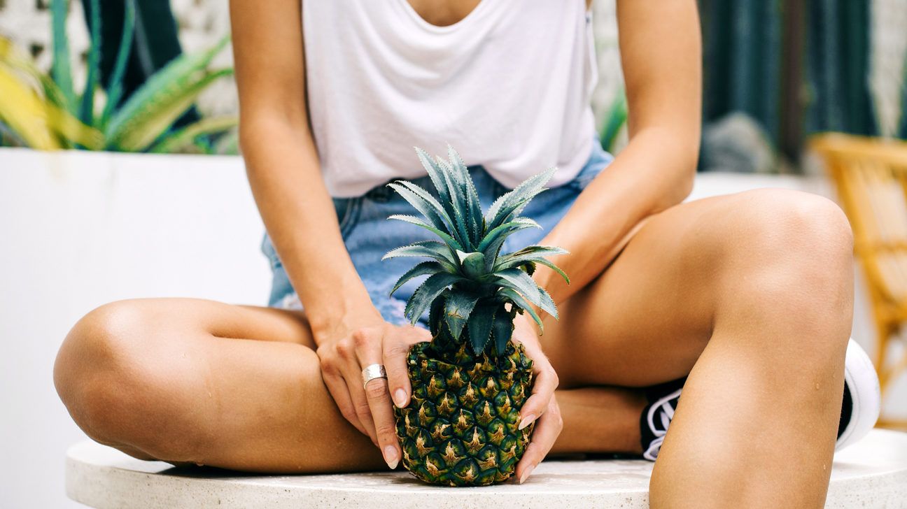 https://media.post.rvohealth.io/wp-content/uploads/sites/2/2019/07/woman-holding-pineapple-header-1296x728.jpg